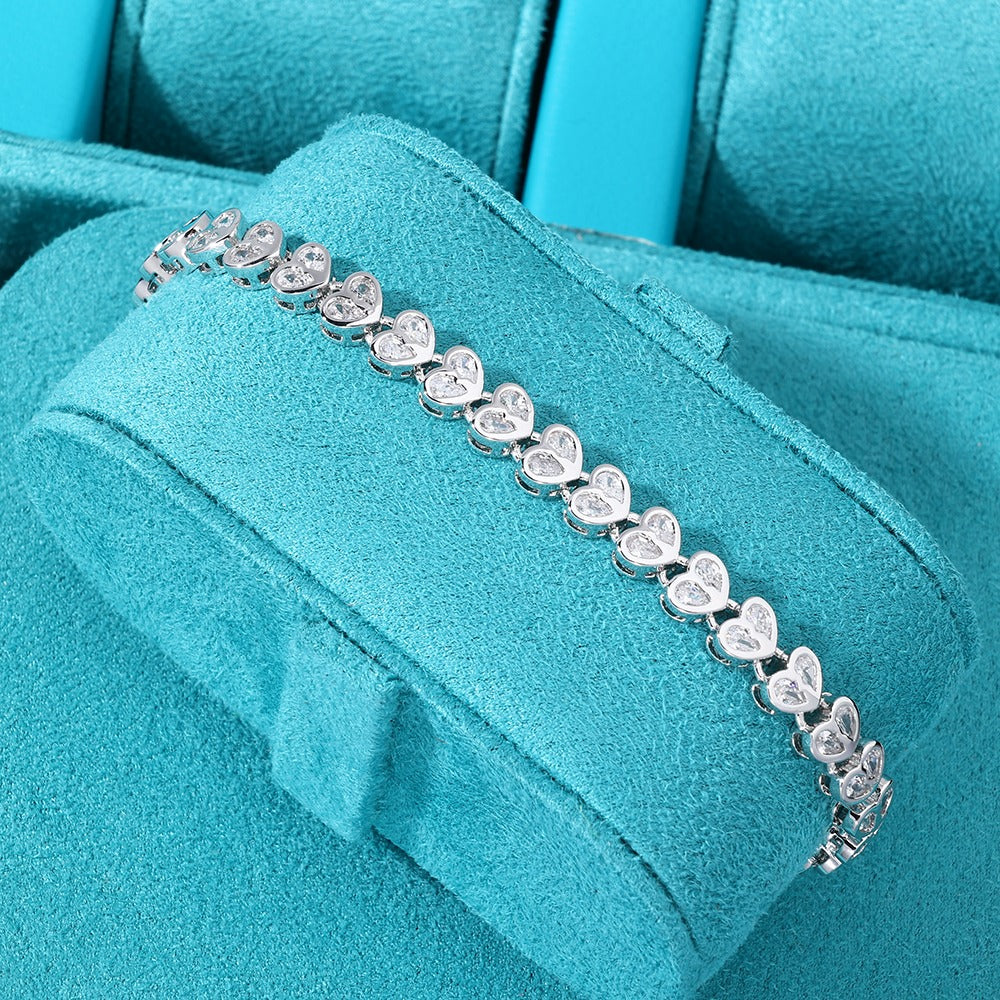 Brazalete whitegold tennis hearts clasp 2025