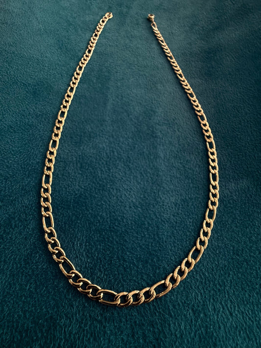 Cadena fígaro laminada en 18k 22 micras