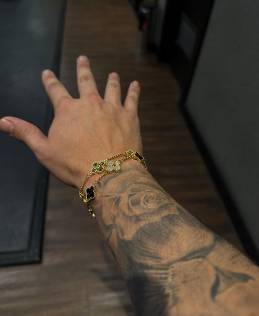 Combo de brazaletes VC. Gold & black y brazalete VC golden x black