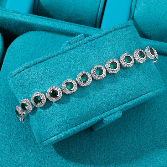 Circle tennis bracelet esmerald whitegold 18k plated colección 2025